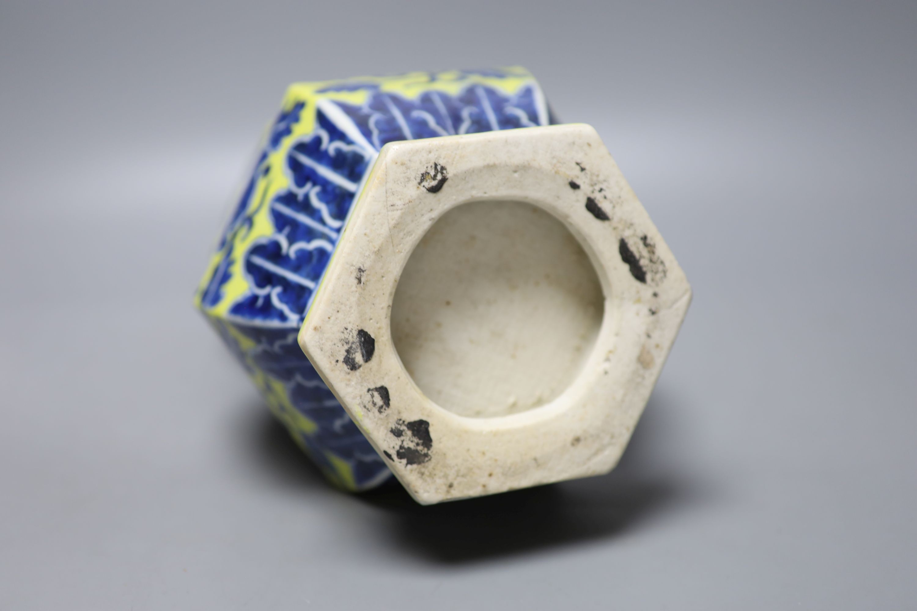 A Chinese underglaze blue yellow ground hexagonal vase, early 20th century, some restoration